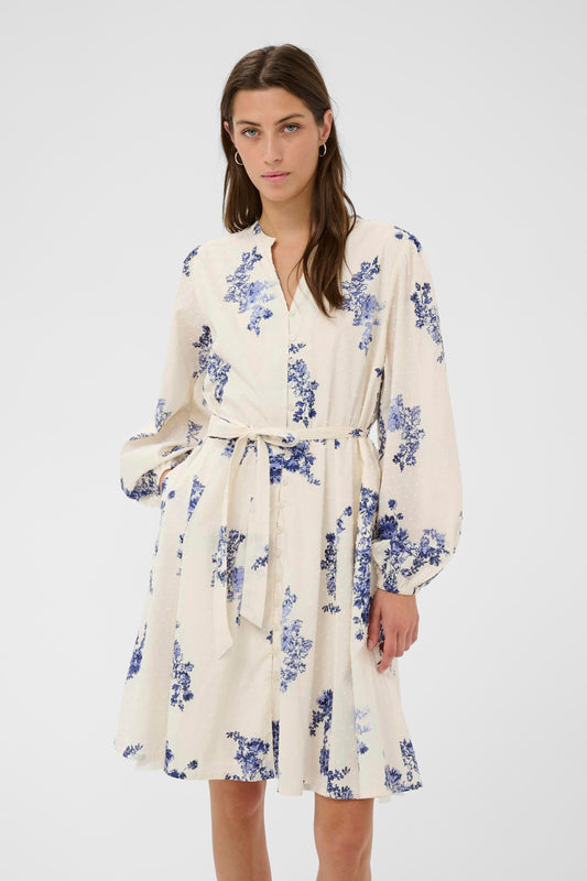 Woman wearing the Part Two Avira White and Blue floral dress on a white background