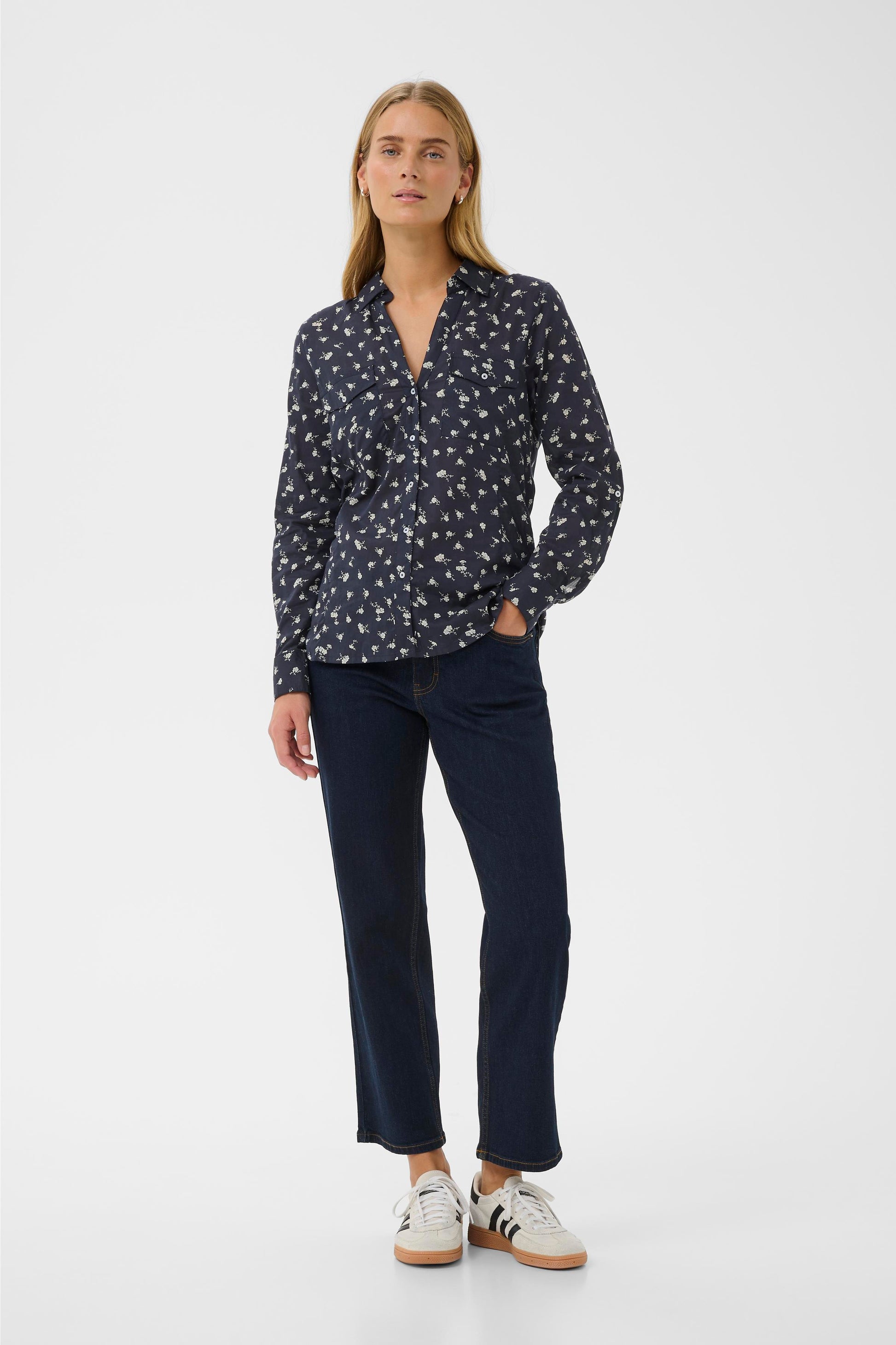 Woman wearing the Part Two Cortnio Shirt in Dark Navy colour with white flowers on it.