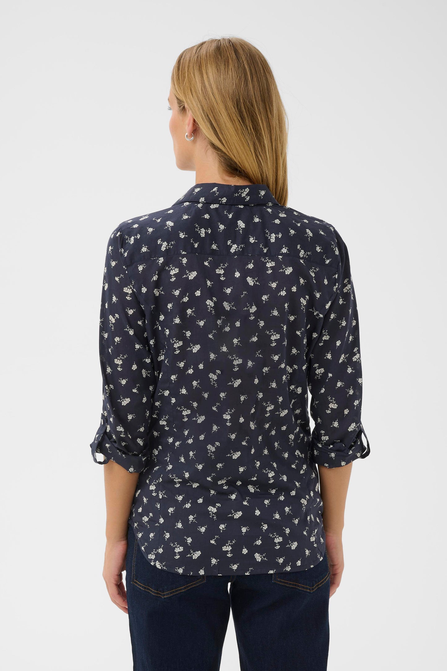 Woman wearing the Part Two Cortnio Shirt in Dark Navy colour with white flowers on it.