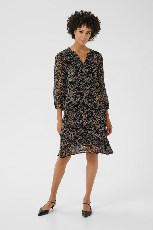 Woman wearing a floral dress on a white background
