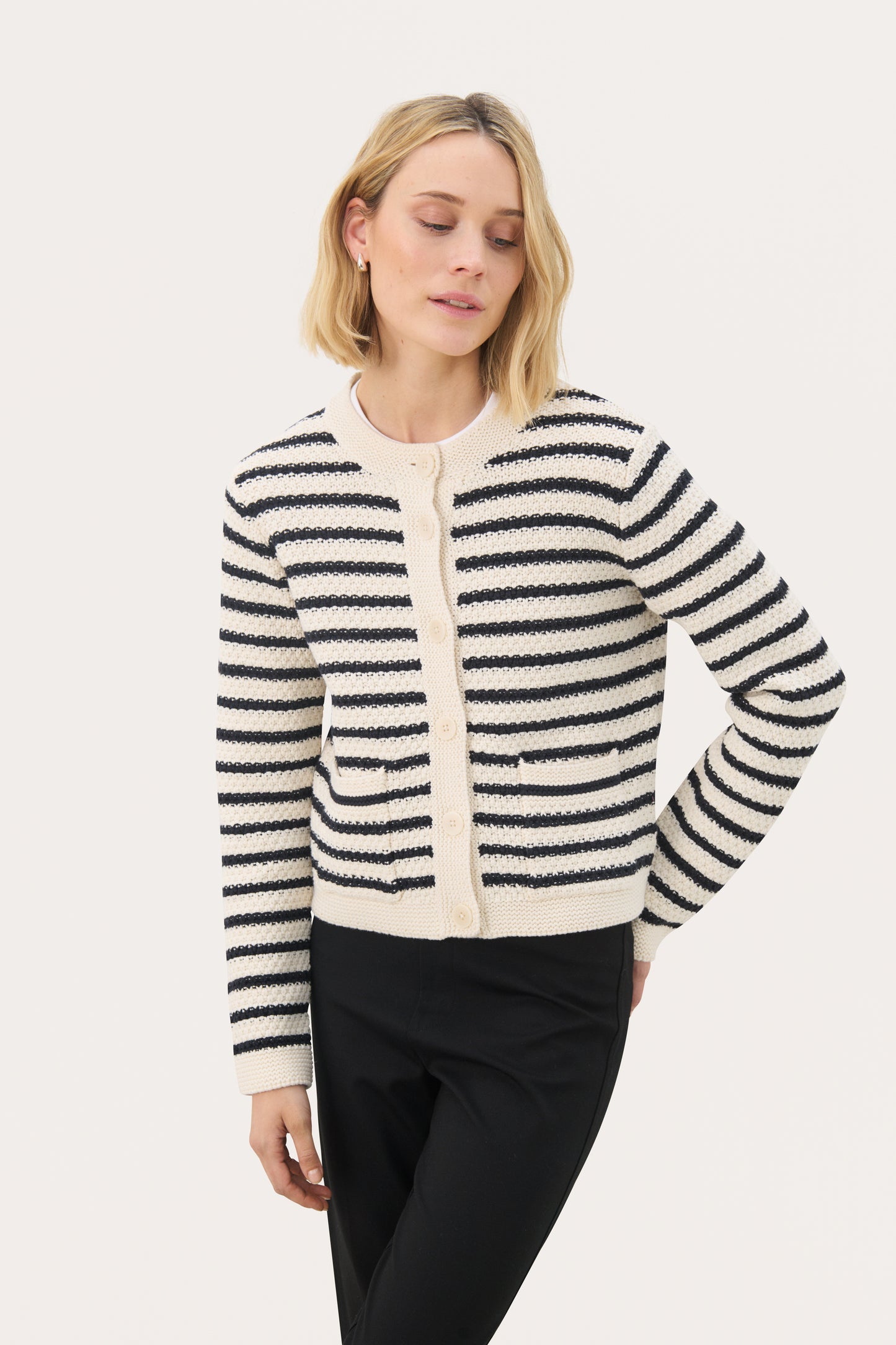 Woman wearing the Part Two Elmie cardigan in a dark navy stripe