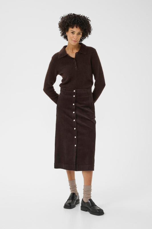 Woman wearing the part two shayla cord brown skirt sweater on a white background