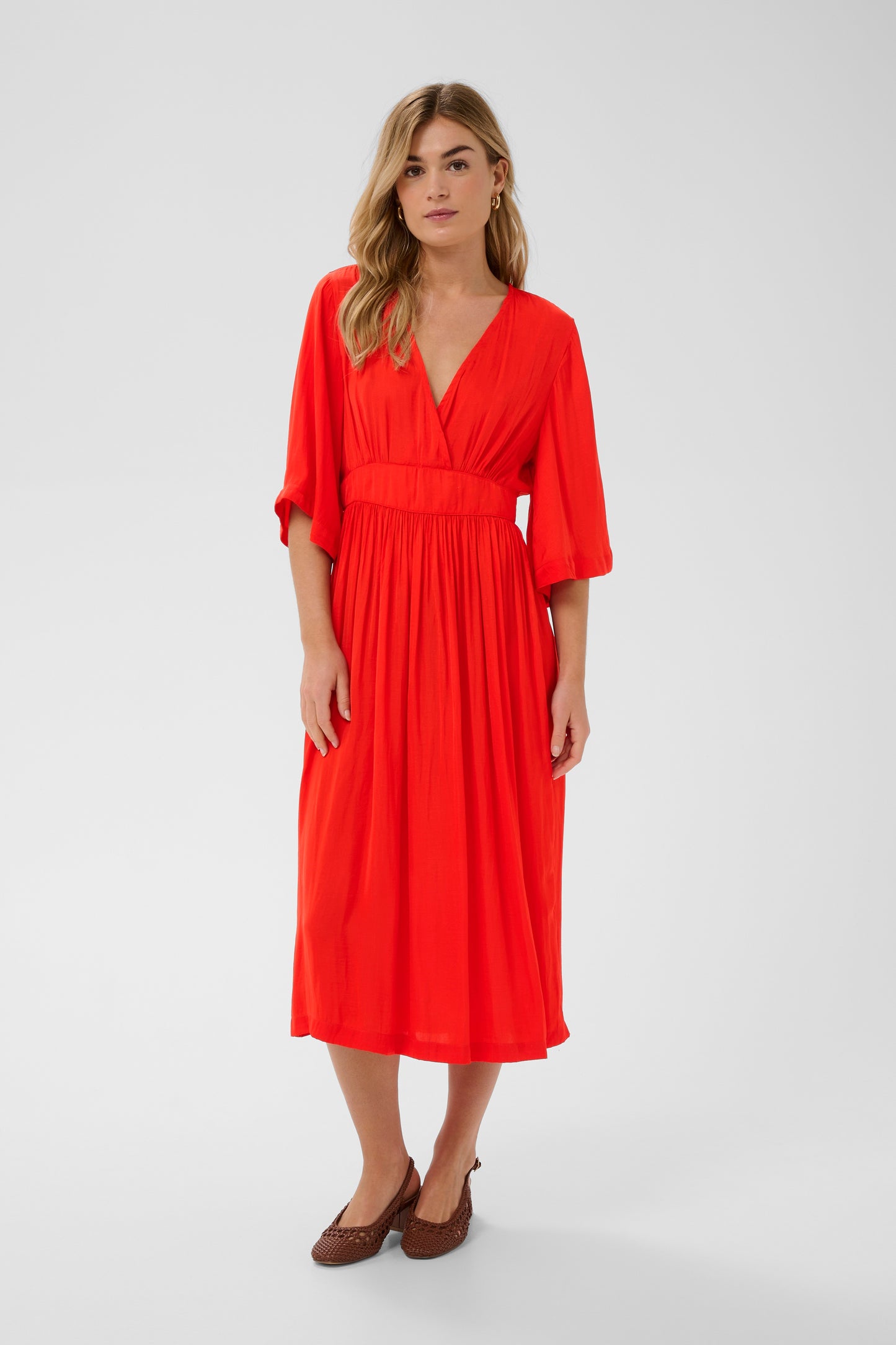 Saint Tropez Dress in striking red colour with 3/4 length sleeves, v-neck and midi length