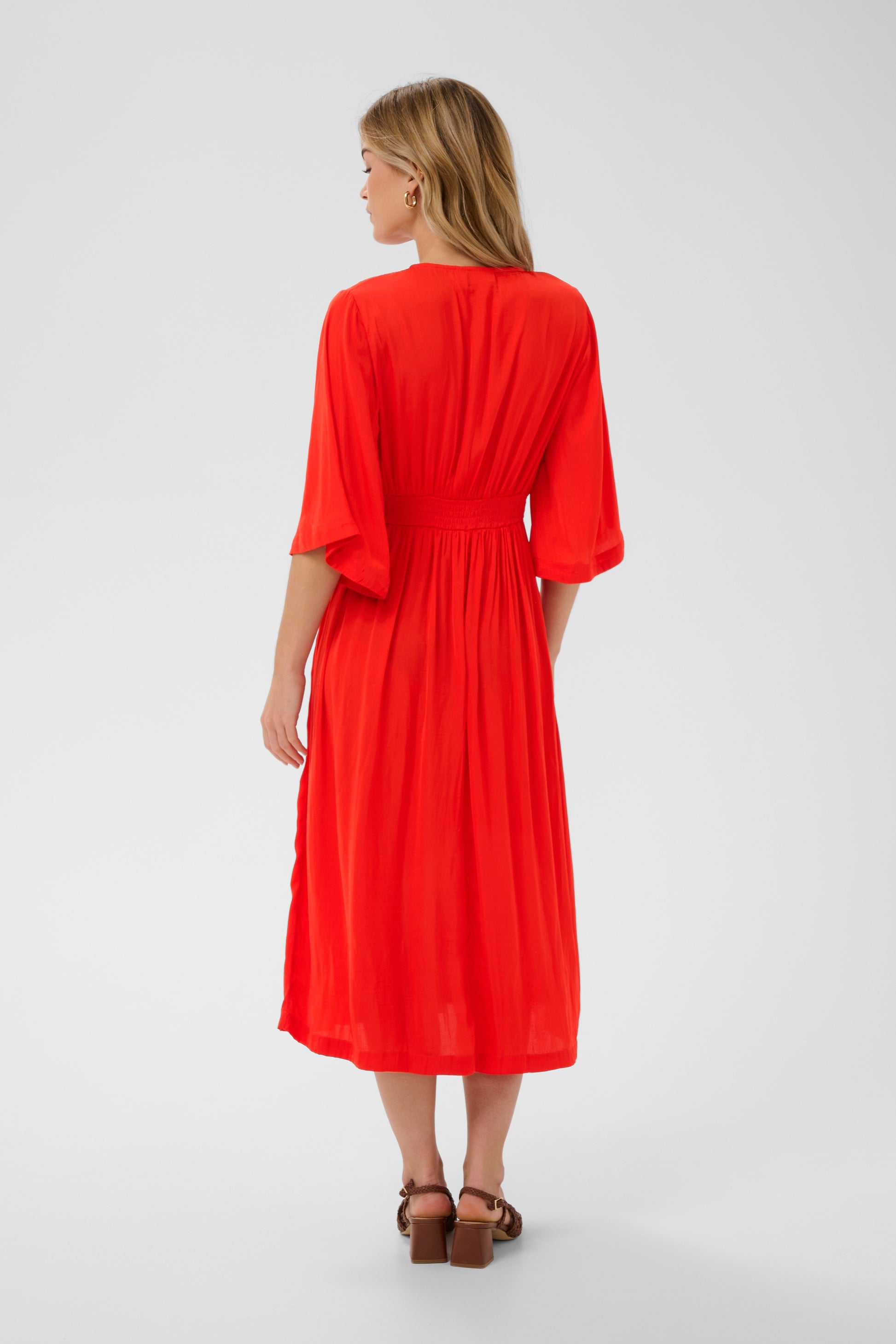 Saint Tropez Dress in striking red colour with 3/4 length sleeves, v-neck and midi length