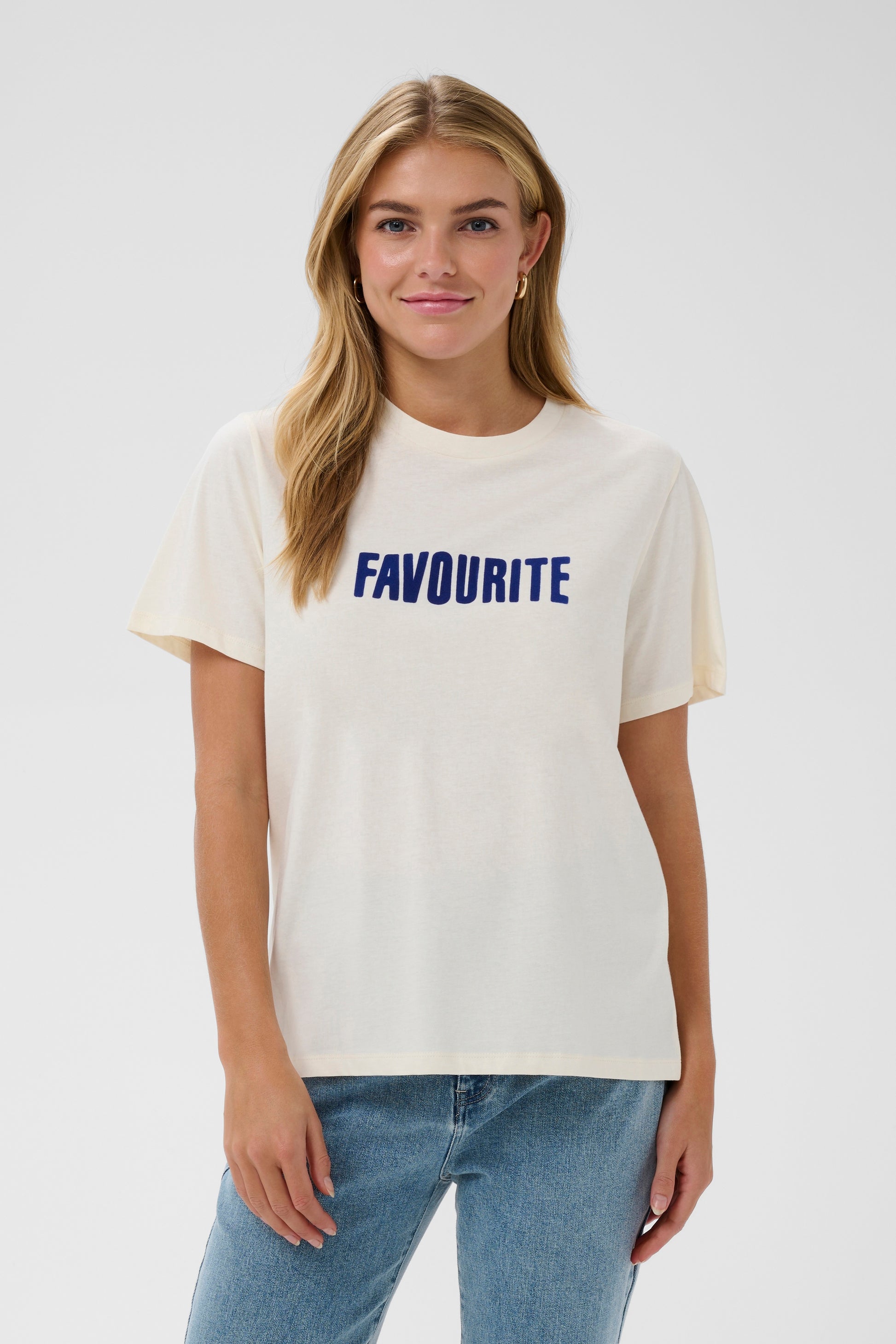 Cream Saint Tropez t-shirt with 'FAVOURITE' printed in blue on a white background
