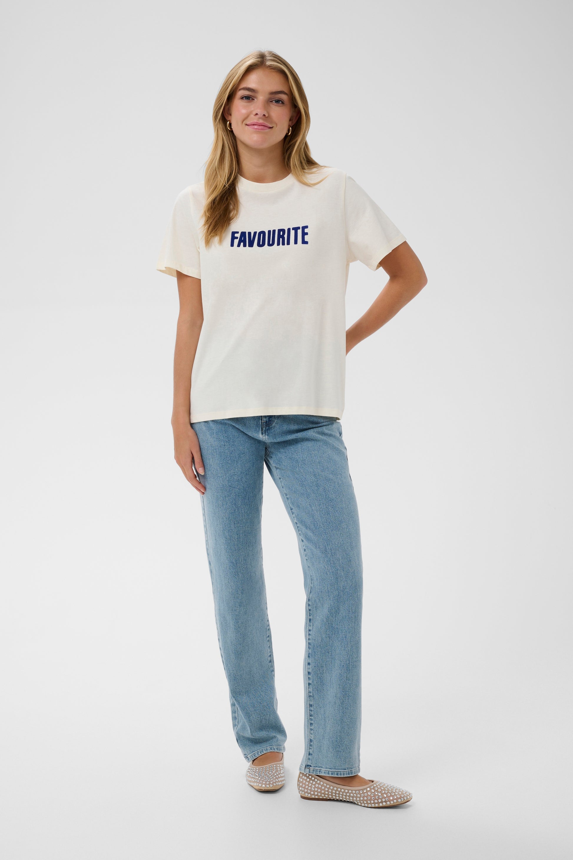 Cream Saint Tropez t-shirt with 'FAVOURITE' printed in blue on a white background