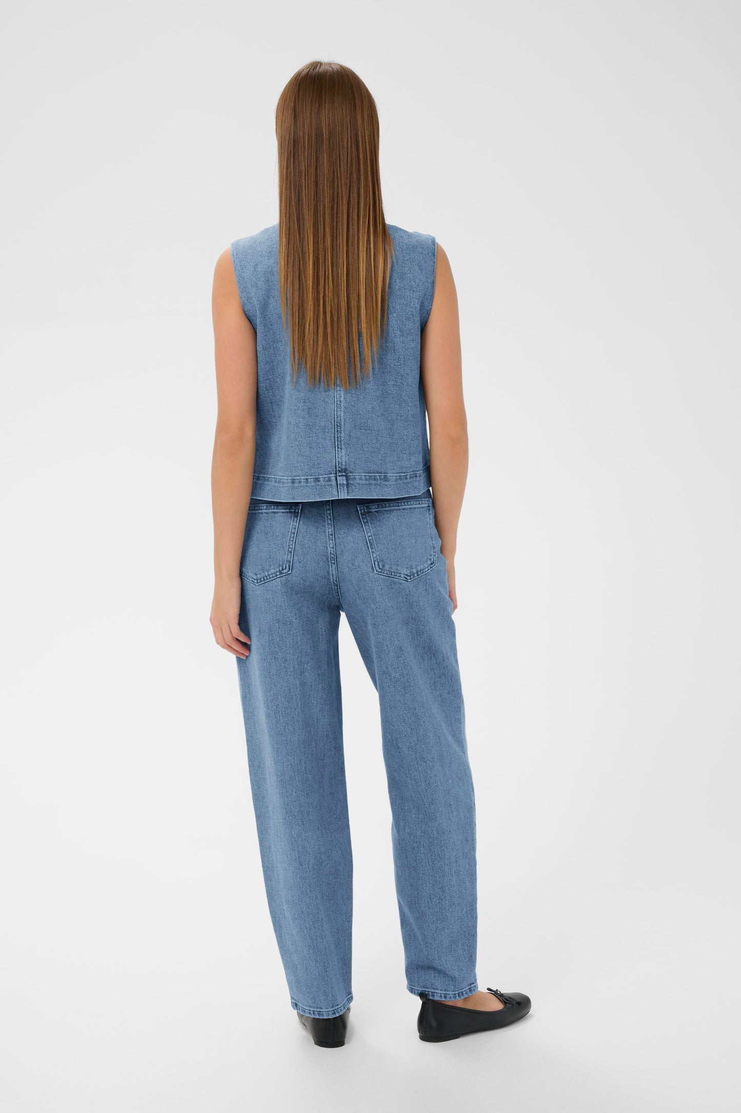 Woman wearing the Soaked in Luxury Rinatina Denim Waistcoat