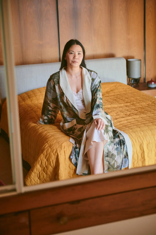 woman wearing one hundred stars gown with the rivers and trees print.