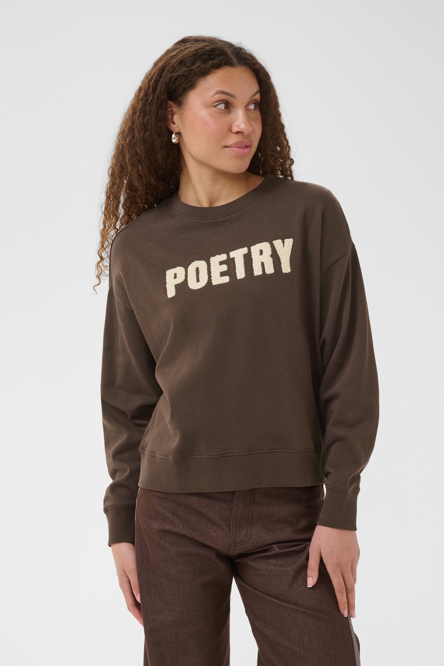 Brown Saint Tropez suzie sweatshirt with the word poetry across the front