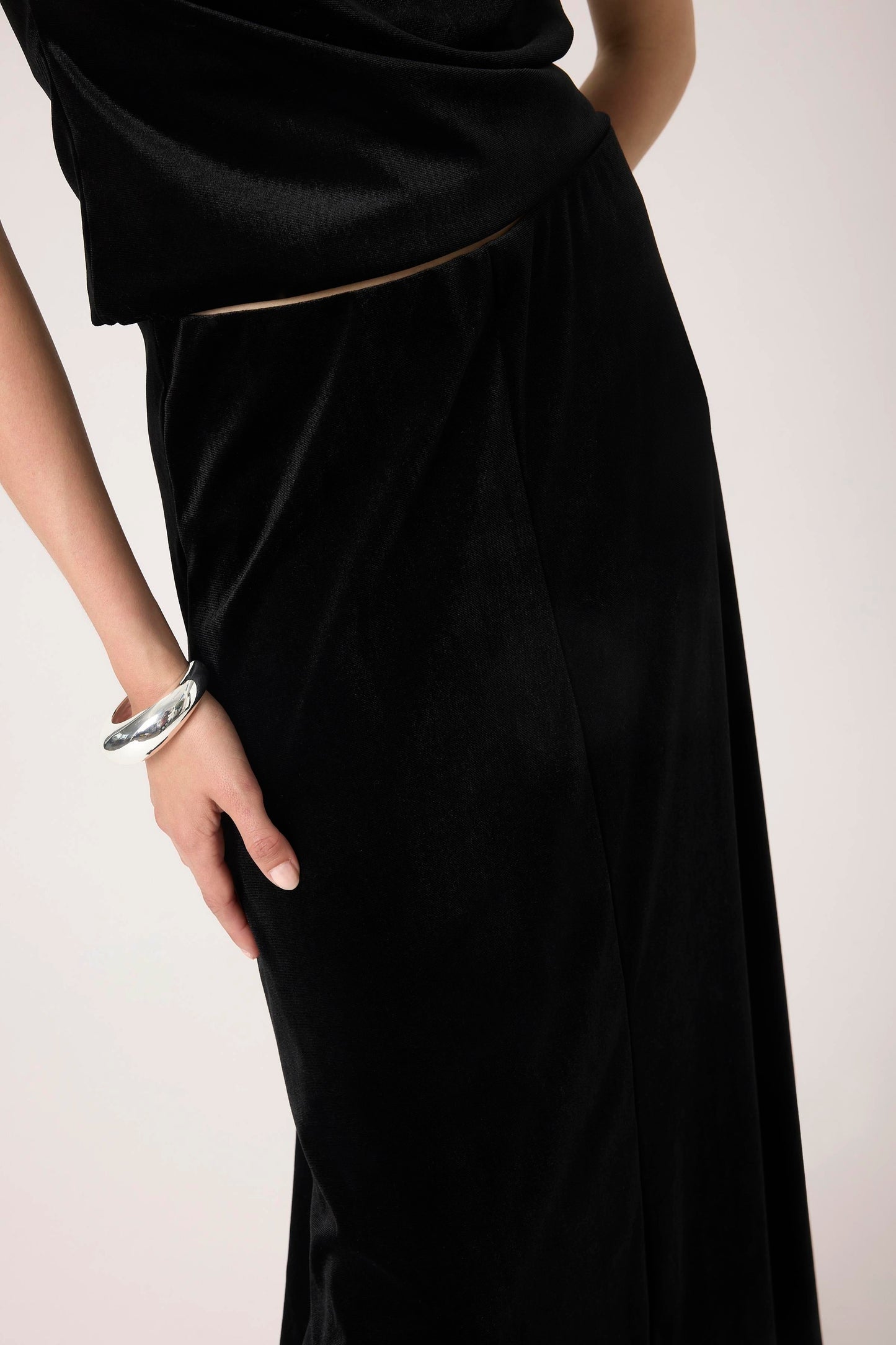 Woman wearing the Soaked in Luxury Black Velera Velvet Skirt