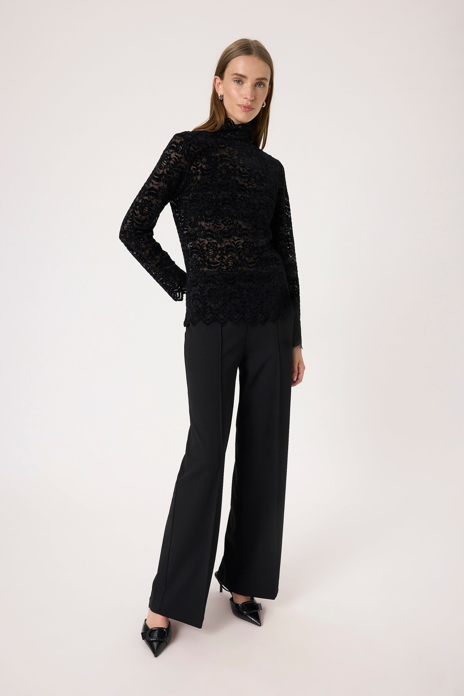 Woman wearing the Soaked in Luxury Sable Lace long sleeved top in black