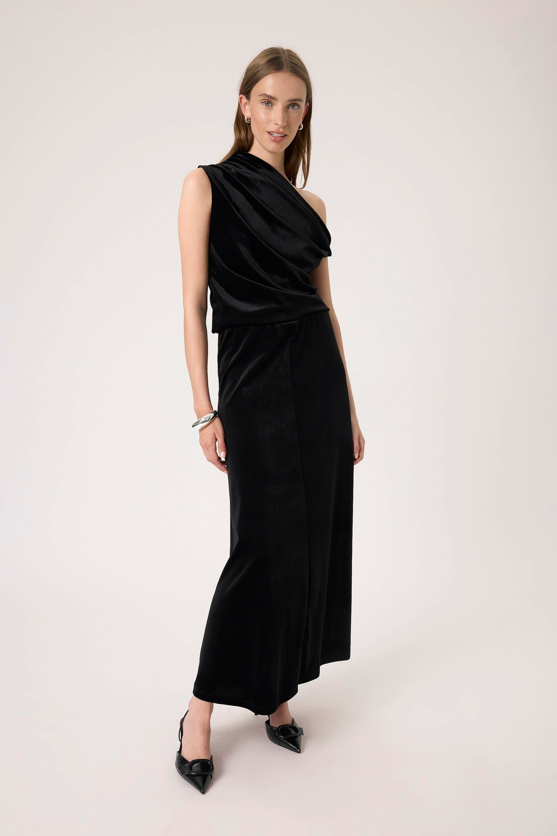 Woman wearing the Soaked in Luxury Black Velera Velvet Skirt