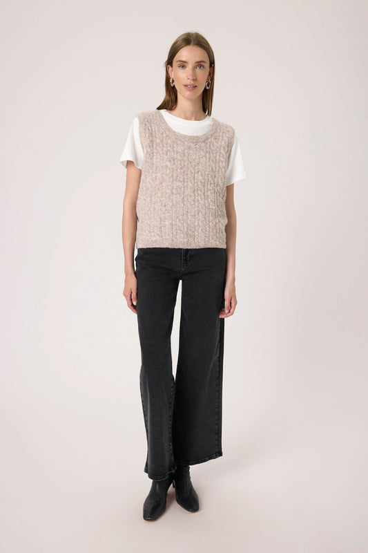 Woman wearing the Soaked in Luxury Vespera beige knitted vest over a white shirt.