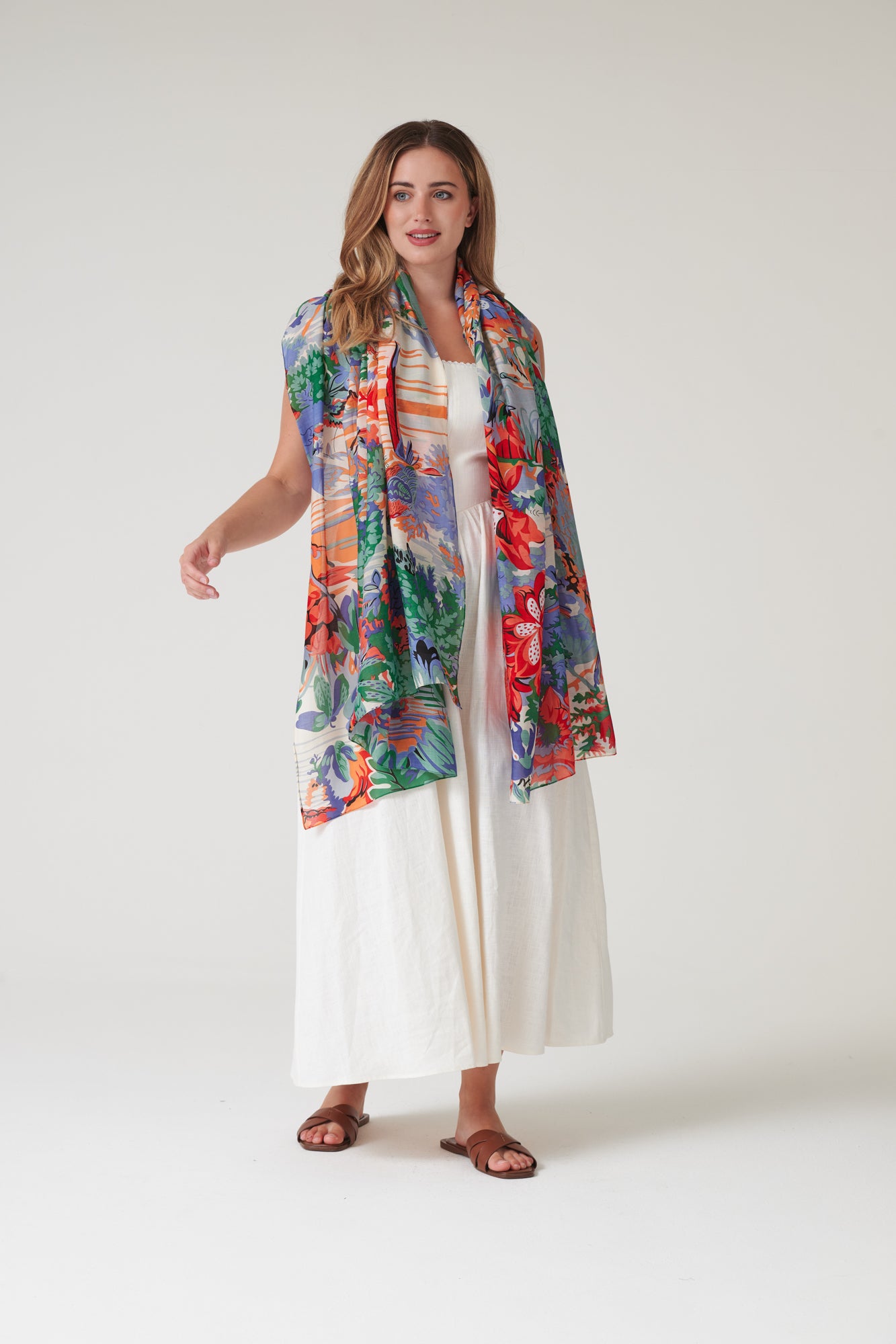 One Hundred Stars Tropicana Blue Scarf featuring a vibrant botanical print in refreshing blue tones.
