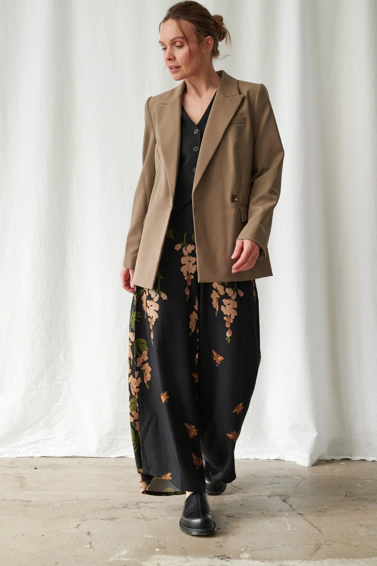 One Hundred Stars Wisteria Black Palazzo Pants featuring a botanical wisteria print on a black background with a flowing wide-leg silhouette