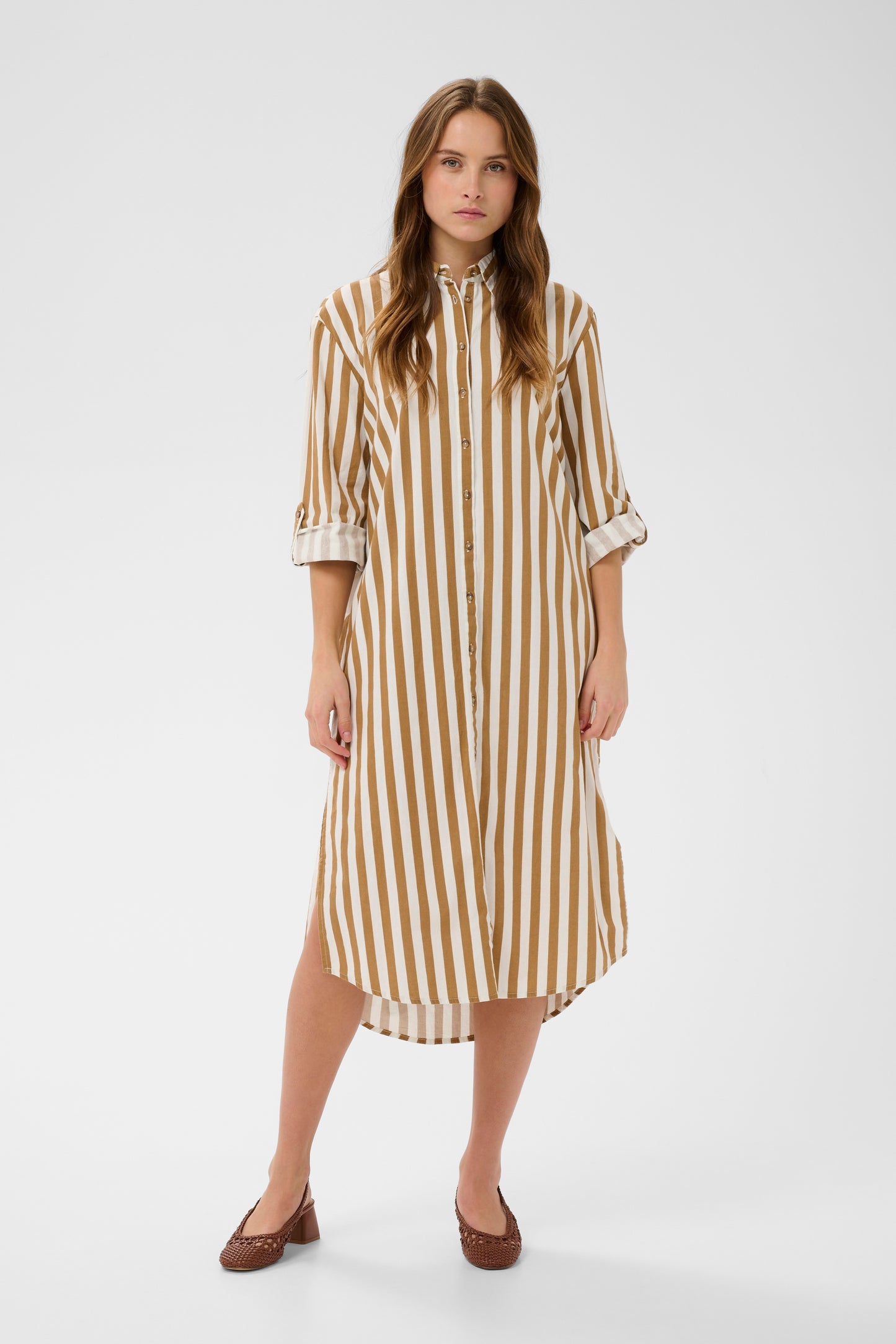 Woman wearing the Zalinda brown and white striped shirt dress 