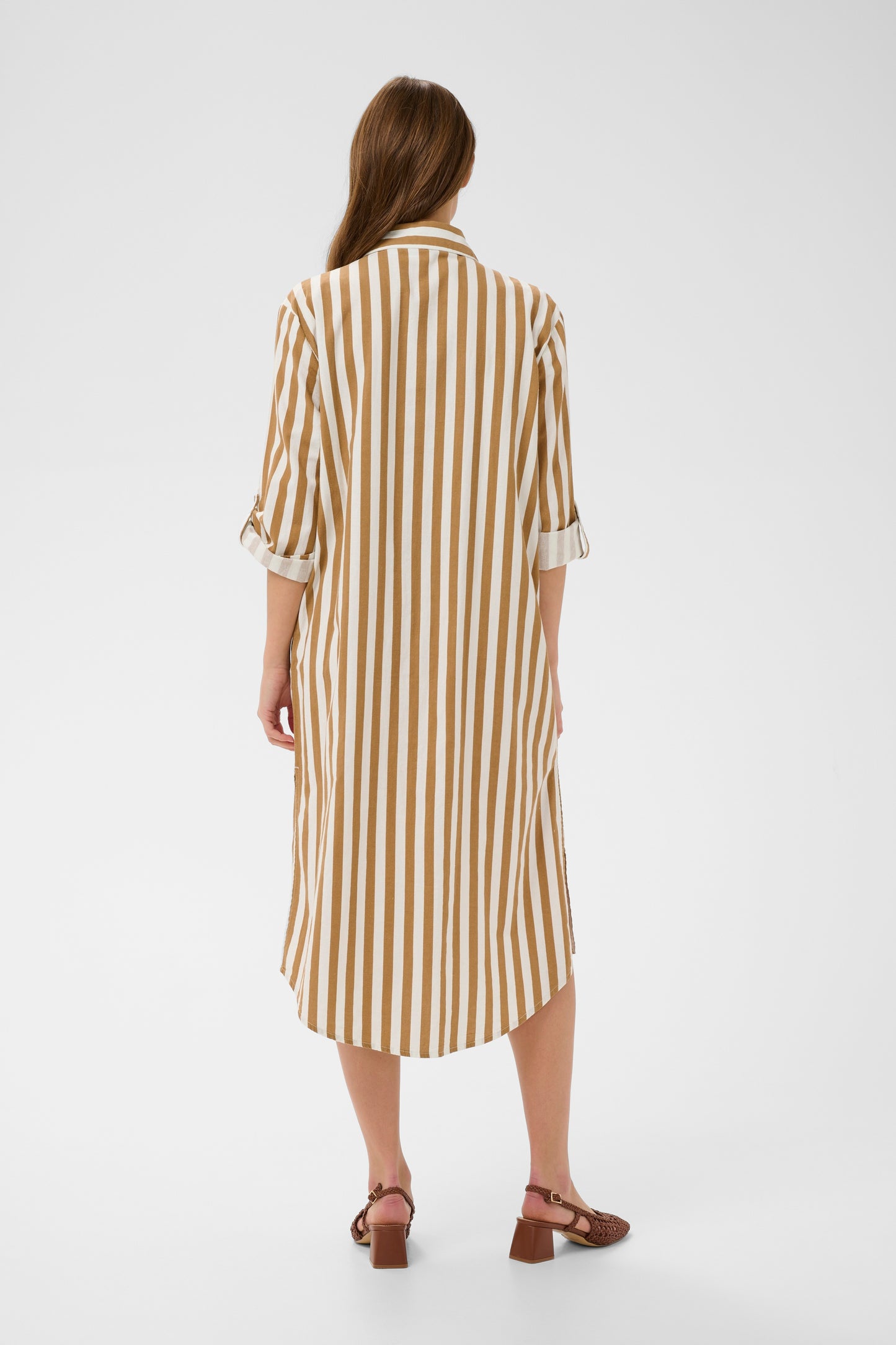 Woman wearing the Zalinda brown and white striped shirt dress 
