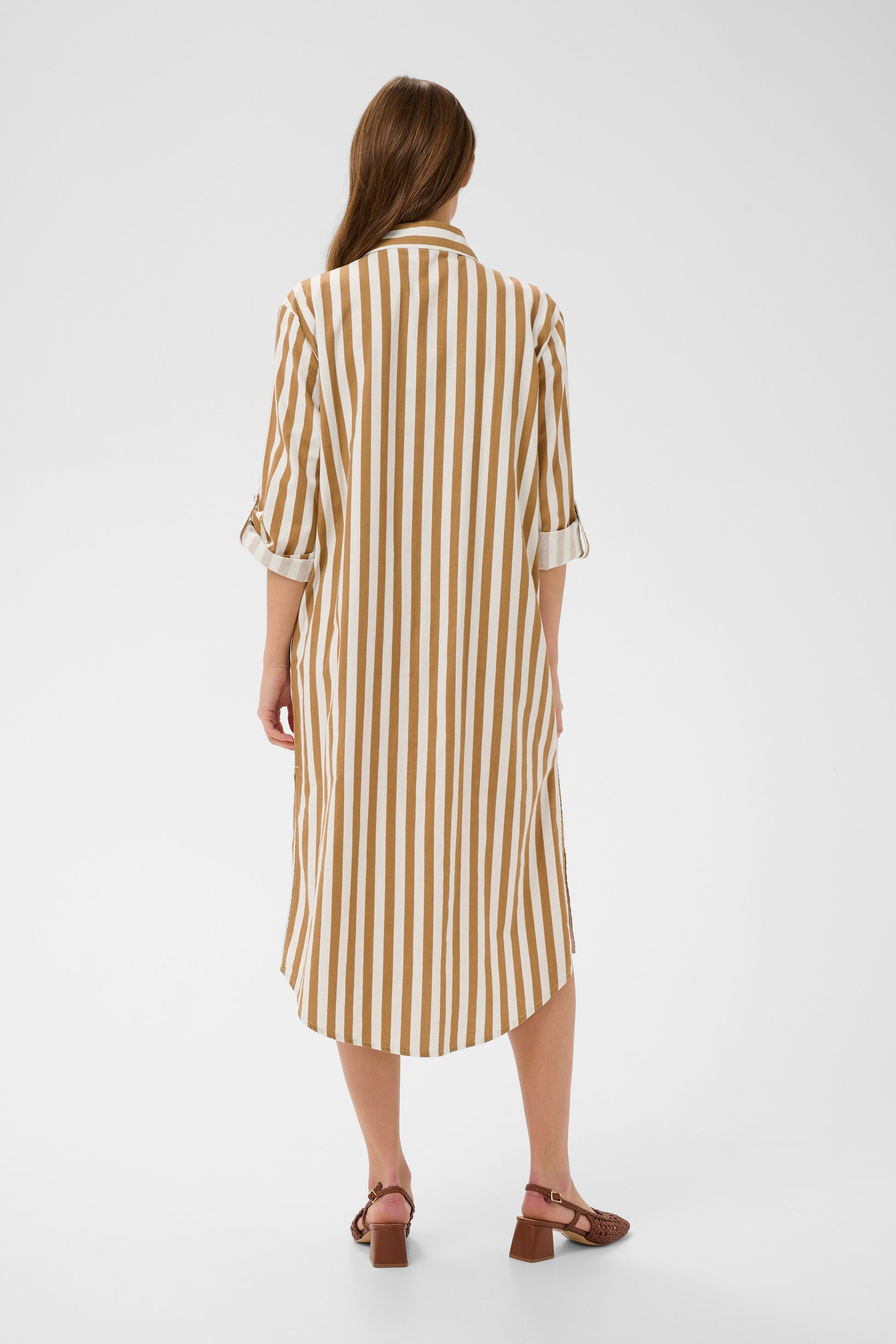 Woman wearing the Zalinda brown and white striped shirt dress 