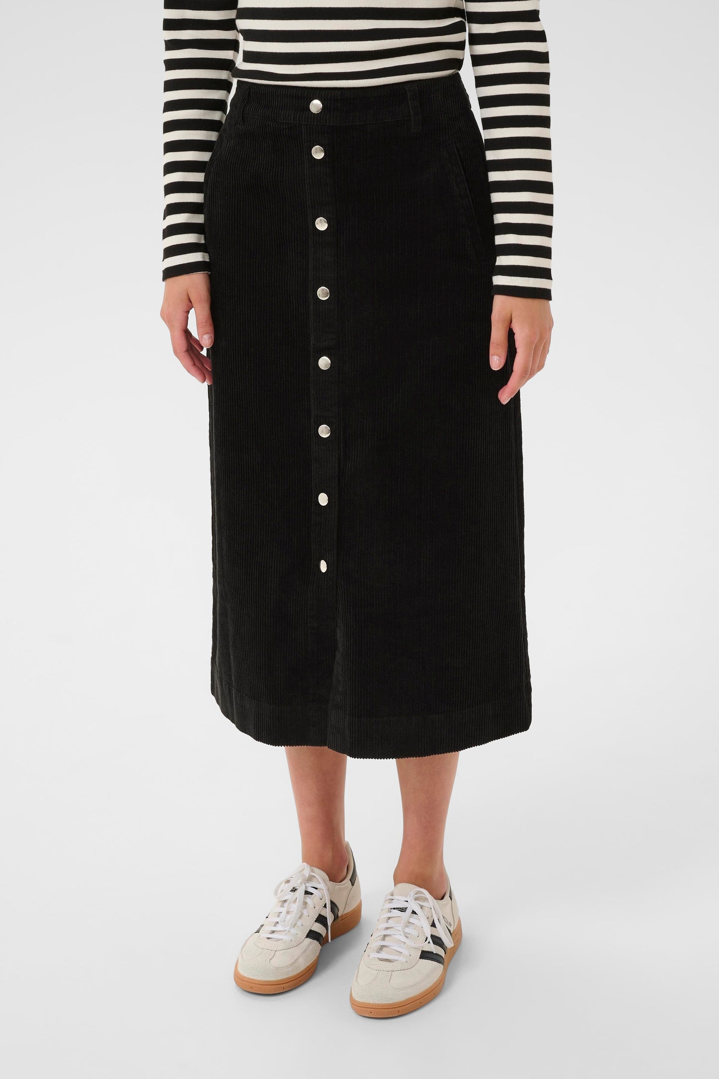 Woman wearing the part two shayla cord brown skirt sweater on a white background close up