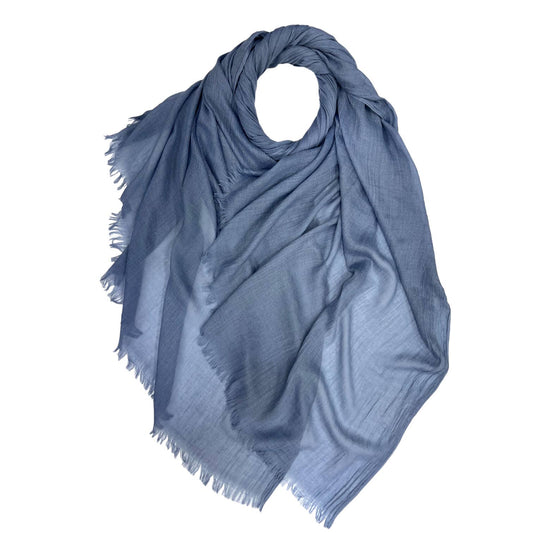 Blue scarf with frayed edges on a white background
