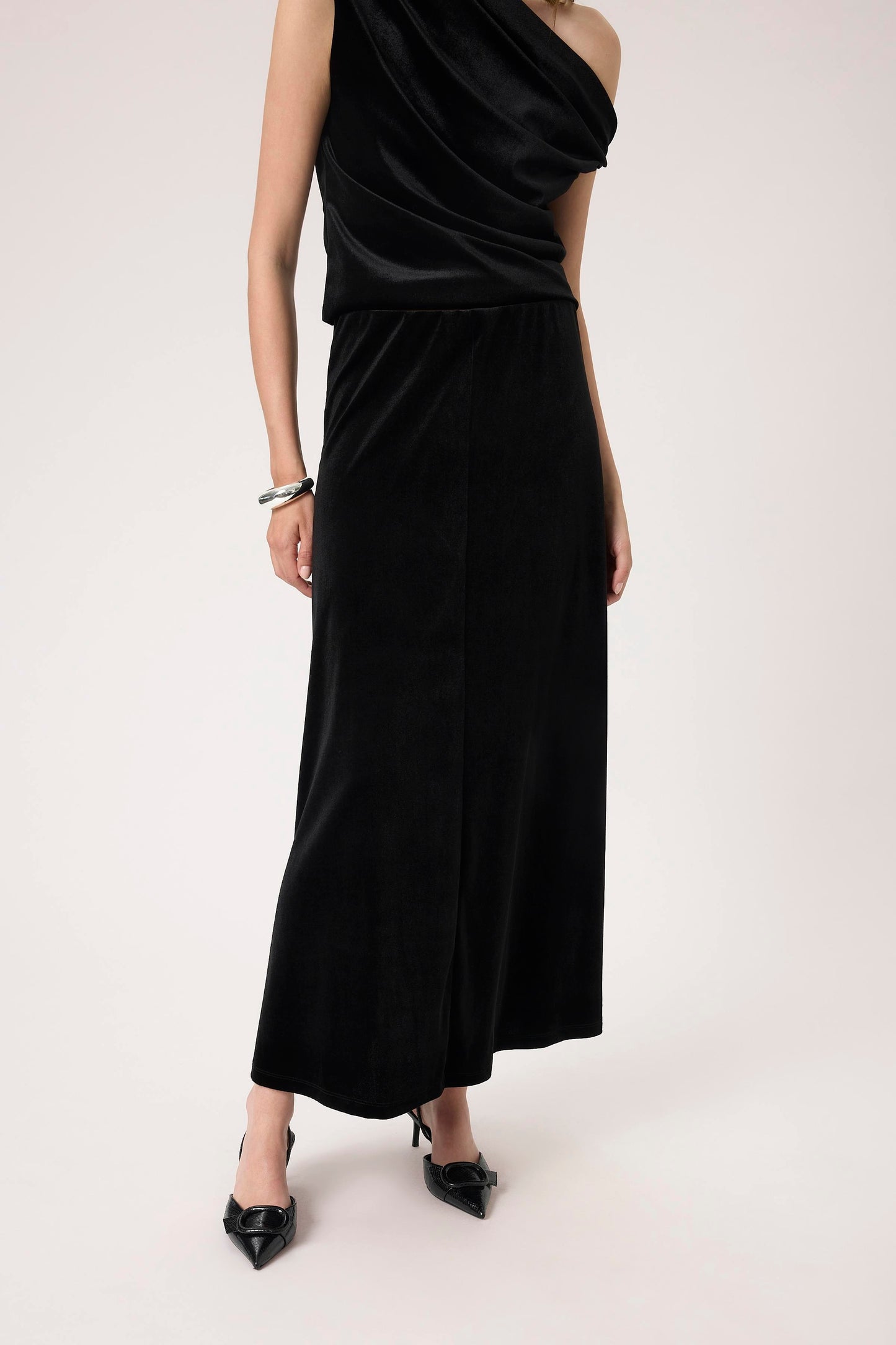 Woman wearing the Soaked in Luxury Black Velera Velvet Skirt