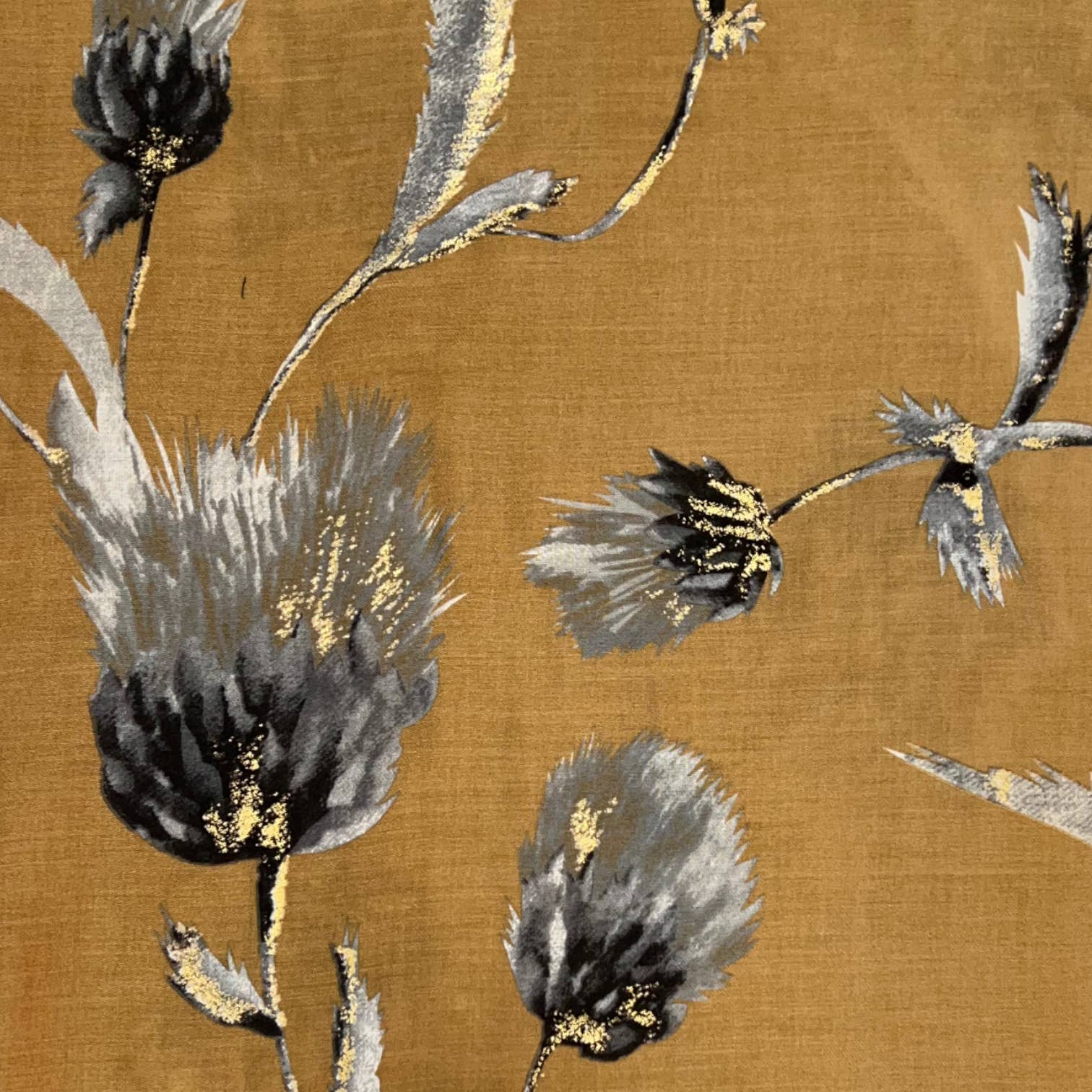 Floral pattern with black and gray flowers on a brown background