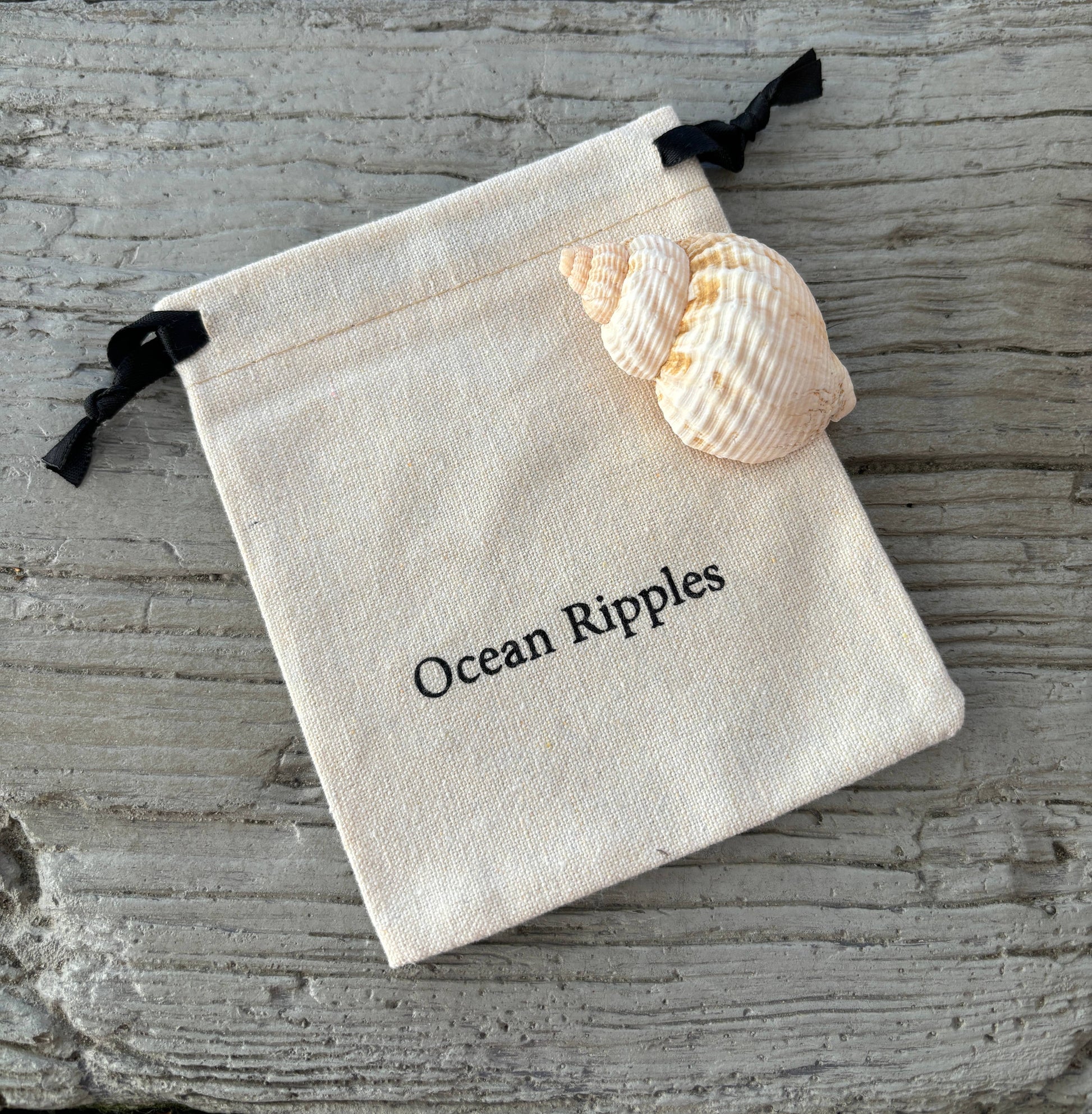 ocean ripples jewellery bag with shell