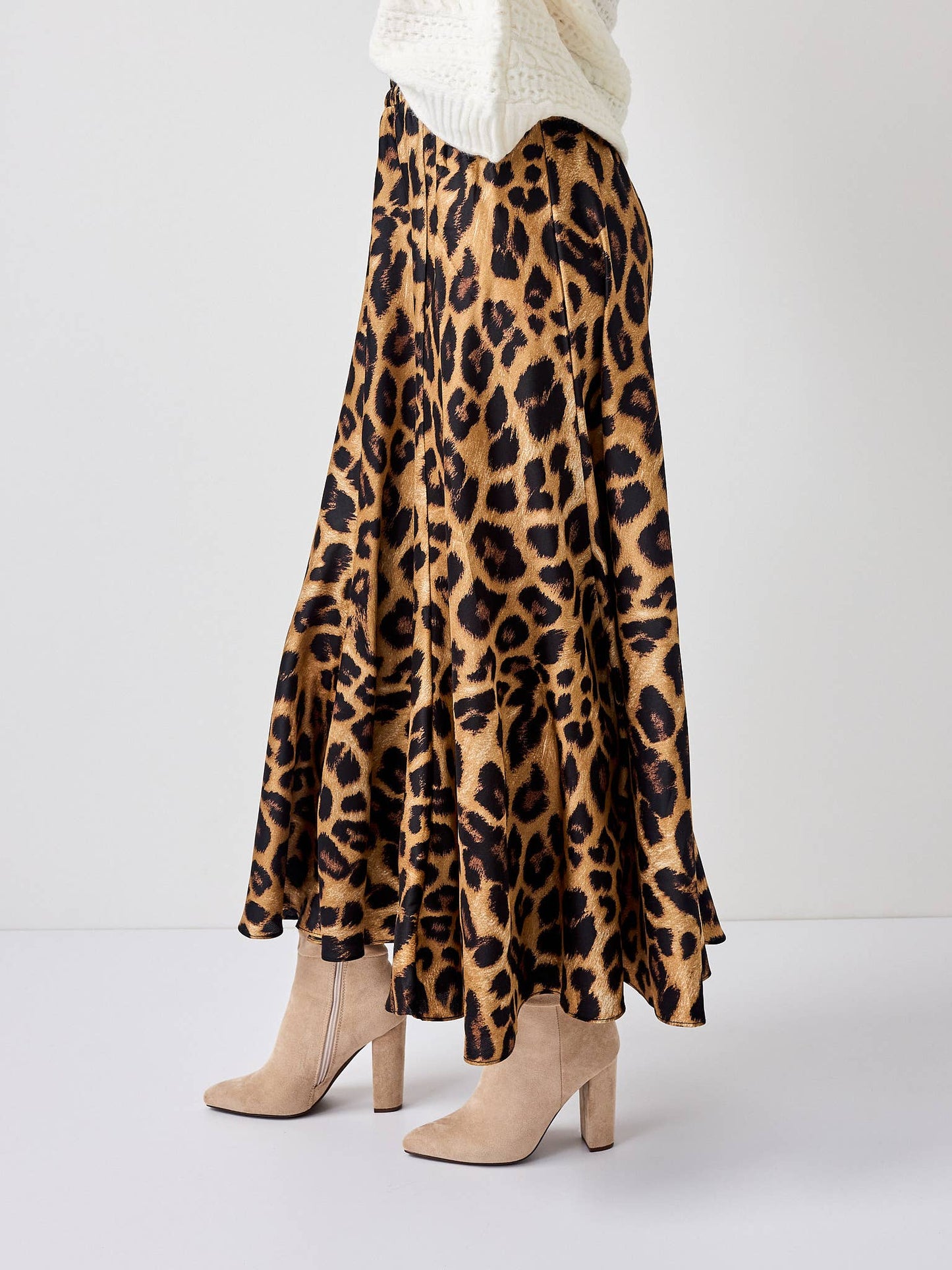 Leopard print skirt worn by a person on a white background