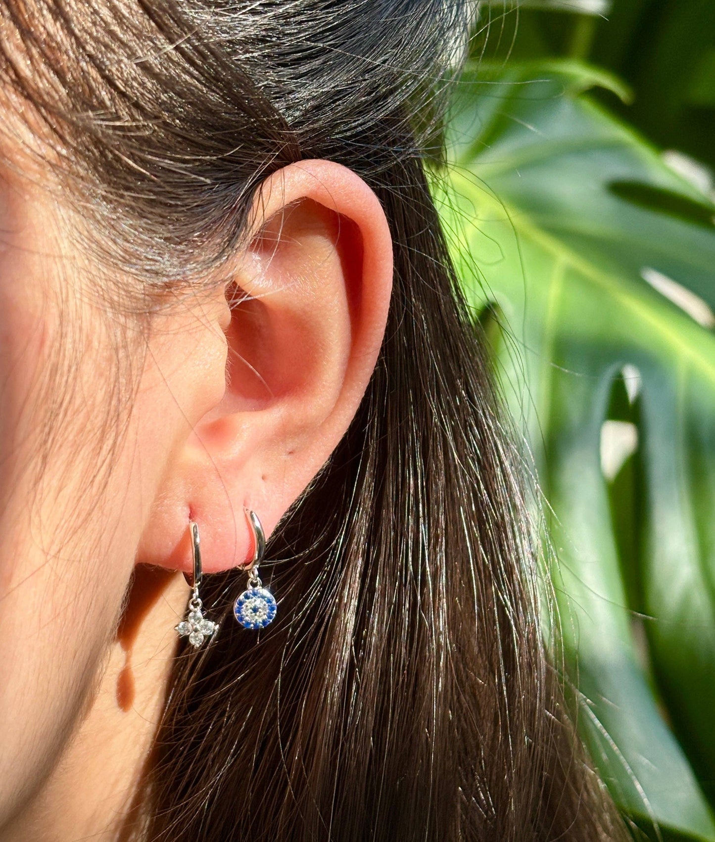 Ocean Ripples 925 sterling silver blue cubic zirconia huggie earrings.