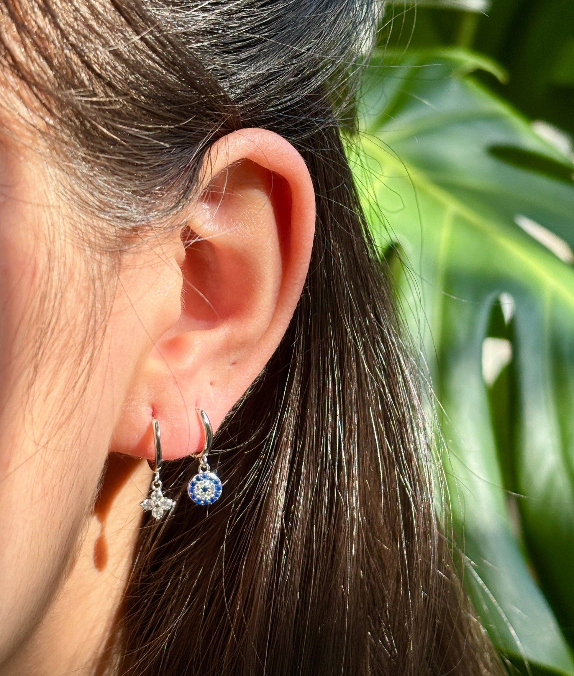 Ocean Ripples 925 sterling silver blue cubic zirconia huggie earrings.