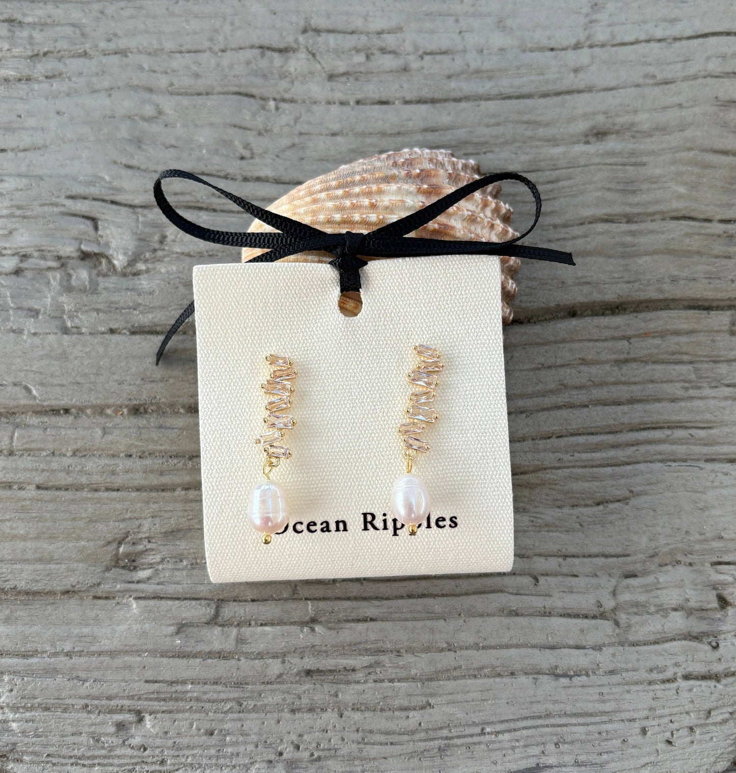 Ocean Ripples 14ct gold plated zig-zag earrings with cubic zirconia and freshwater pearl drops.